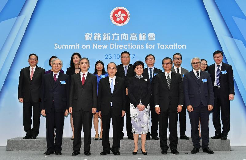 The Chief Executive, Mrs Carrie Lam, attended the Summit on New Directions for Taxation held at the Central Government Offices this afternoon (October 23). Photo shows Mrs Lam (front row, third right); the Chief Secretary for Administration, Mr Matthew Cheung Kin-chung (front row, third left); the Financial Secretary, Mr Paul Chan (front row, second right); the Secretary for Financial Services and the Treasury, Mr James Lau (front row, second left); the Director of the Centre for Tax Policy and Administration of the Organisation for Economic Co-operation and Development, Mr Pascal Saint-Amans (front row, first right); and the Ralph and Claire Landau Professor of Economics at the Lau Chor Tak Institute of Global Economics and Finance, Chinese University of Hong Kong, Professor Lawrence Lau (front row, first left), with other guests.