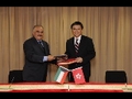 The Secretary for Financial Services and the Treasury, Professor K C Chan (right), exchanges document with the Kuwaiti Minister of Finance, Mr Mustafa Al Shamali, after signing an agreement for the avoidance of double taxation and the prevention of fiscal evasion with respect to taxes on income today (May 13).