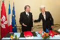 Mr Tsang and Mrs Lagarde have a chat before signing an agreement for the avoidance of double taxation and the prevention of fiscal evasion with respect to taxes on income and on capital between Hong Kong and France.