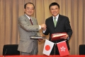 The Secretary for Financial Services and the Treasury, Professor K C Chan (right), signs with the Consul-General of Japan in Hong Kong, Mr Yuji Kumamaru, an agreement for the avoidance of double taxation and the prevention of fiscal evasion with respect to taxes on income today (November 9).