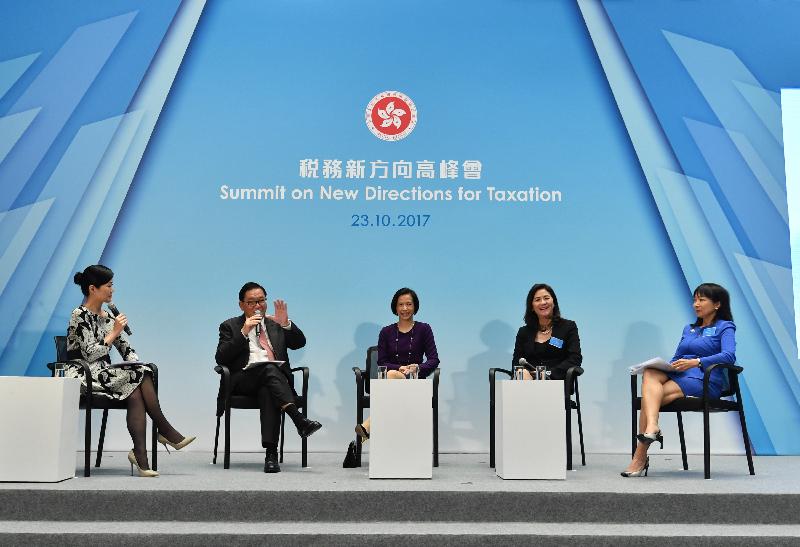 Leaders from the business sector and the accounting profession participate in a panel discussion to exchange views on tax initiatives for enhancing economic development at the Summit on New Directions for Taxation at the Central Government Offices in Tamar today (October 23).