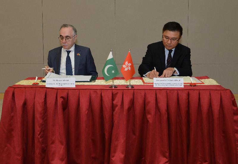 The Secretary for Financial Services and the Treasury, Professor K C Chan (right), exchanges documents with the Ambassador of the Islamic Republic of Pakistan for the People's Republic of China, Mr Masood Khalid (left), after signing the comprehensive agreement for the avoidance of double taxation today (February 17).